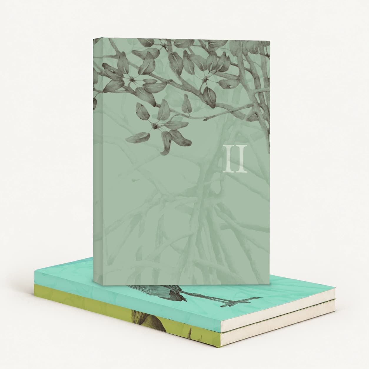 Breakwater Book II with a mangrove-leaf cover standing on the stacked Books III and I