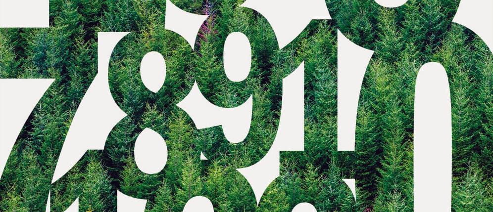 Forest-filled numbers from Plum Creek’s sustainability report cover against pale warm gray paper
