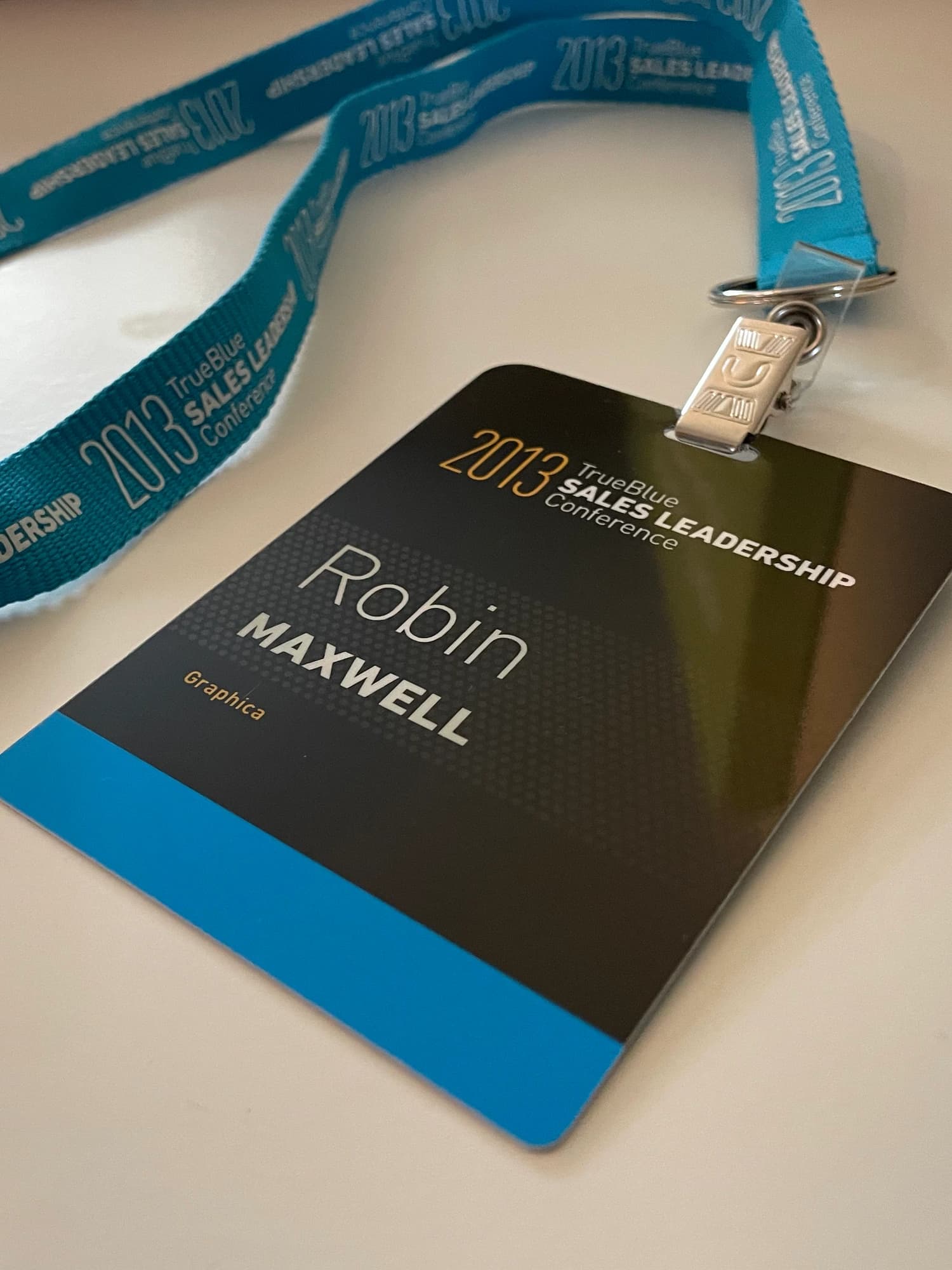TrueBlue Sales Leadership Conference name badge and blue branded lanyard
